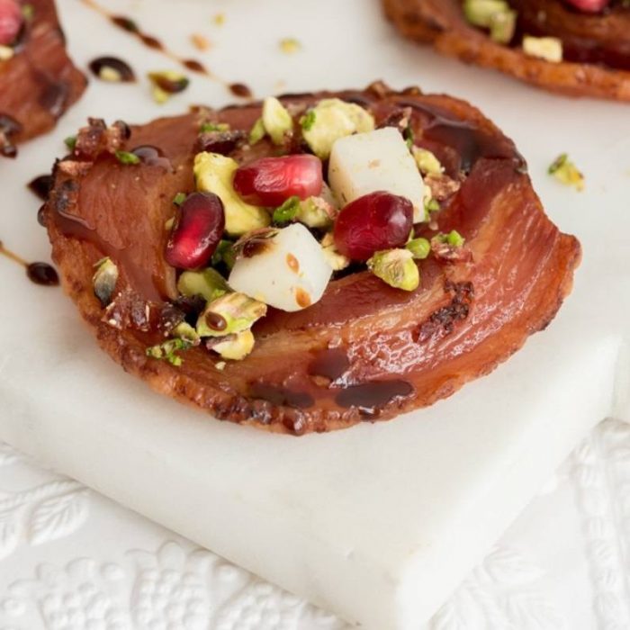 Pancetta chips, with cheese and pistachio salsa.